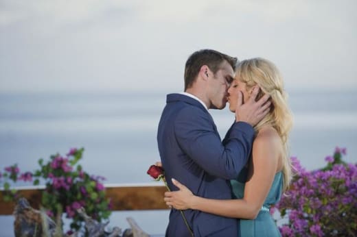 Matt Grant kisses his wife.